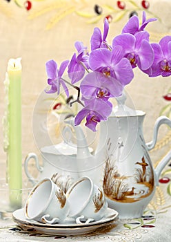 Still life with an orchid and candles