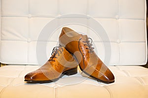 Still life of a pair of clasical light brown men shoes