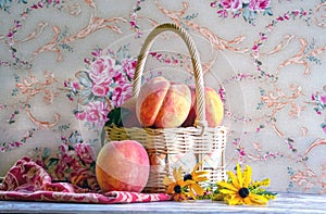 still life of peaches in a light basket