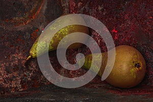 Still life pear- rusty metal background