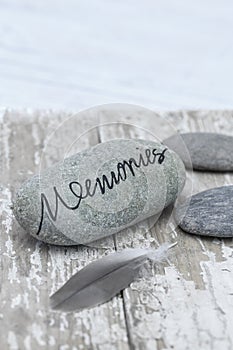 Still life with pebble with word memories on it