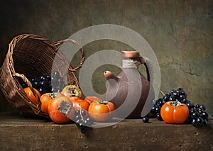 Still life with persimmons and grapes