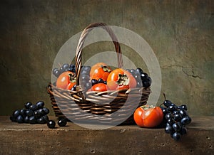 Still life with persimmons and grapes