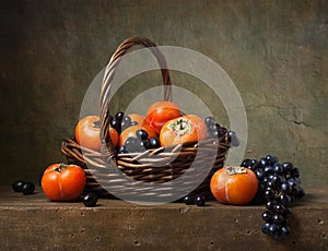 Still life with persimmons and grapes photo