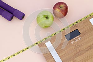 Still Life photography with apples, weight tape measure and a scale photo