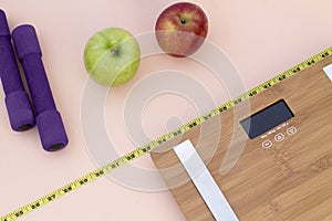 Still Life photography with apples, weight tape measure and a scale photo