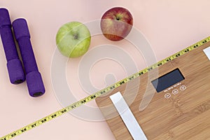 Still Life photography with apples, weight tape measure and a scale photo