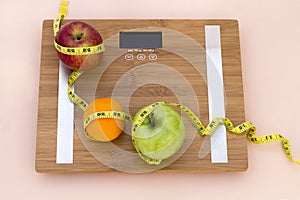 Still Life photography with fruits, tape mesaure and a scale photo