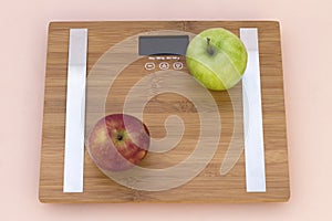 Still Life photography with red and green apple and a scale photo