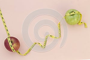 Still Life photography with two apples, tape mesaure photo