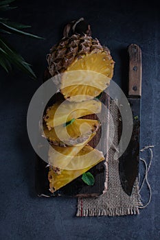 Still life of pineapple whole on wooden stand