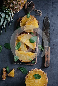 Still life of pineapple whole on wooden stand