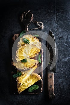 Still life of pineapple whole on wooden stand