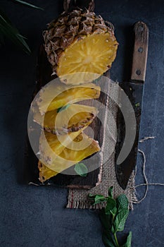 Still life of pineapple whole on wooden stand