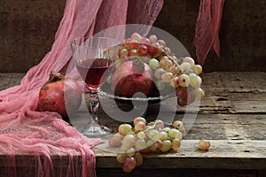 Still life with pomegranate and red wine