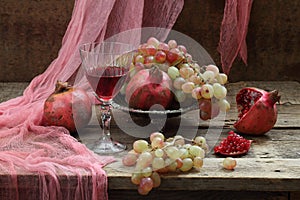 Still life with pomegranate and red wine