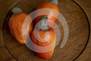 Still life with a portion of cashews, on a rustic wooden plate