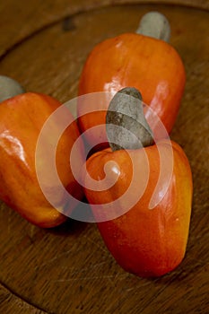 Still life with a portion of cashews, on a rustic wooden plate