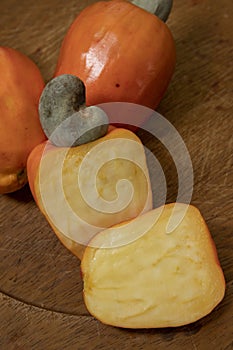 Still life with a portion of cashews, on a rustic wooden plate