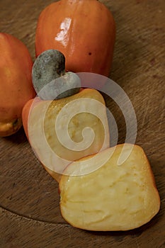 Still life with a portion of cashews, on a rustic wooden plate