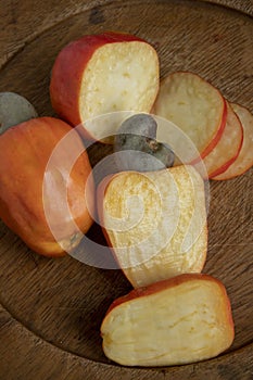 Still life with a portion of cashews, on a rustic wooden plate