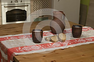 Still life with pottery, milk and bread in the kitchen