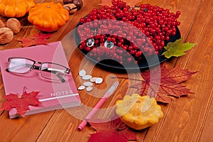 Still life with pumpkin - Pattinson.A notebook with a fountain pen, a glass of tea. Glasses