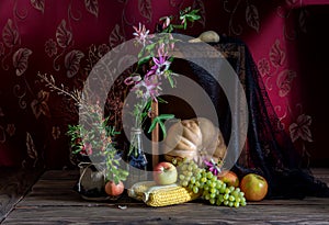 Still Life with pumpkin on wooden background.