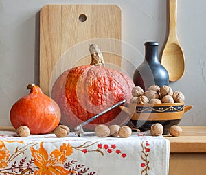 Still life with pumpkins and a bottle of homemade wine.