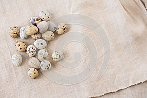 Still life. Quail eggs on a textile napkin. Rustic. Easter celebration concept