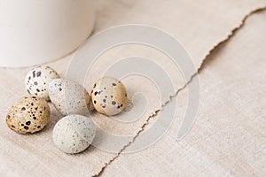 Still life. Quail eggs on a textile napkin. Rustic. Easter celebration concept