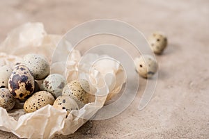 Still life. Quail eggs on a textured background. Rustic. Easter celebration concept
