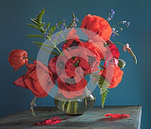 Still life with red poppies