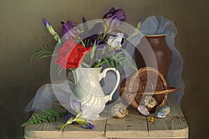 Still life with red poppy and irises , the ceramic vase and the basket of shells