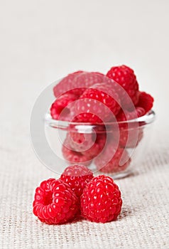 Still life with red raspberry and glass bowl