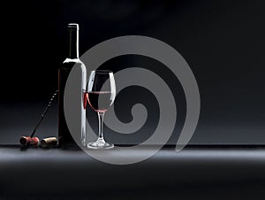 Still life with red wine on black background