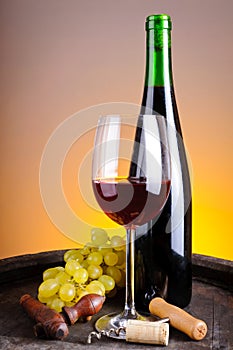 Still life with red wine and grapes