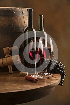 Still life with red wine and wood barrel