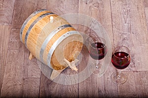 Still life with red wine and wooden cask.