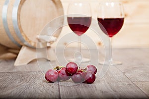 Still life with red wine and wooden cask.