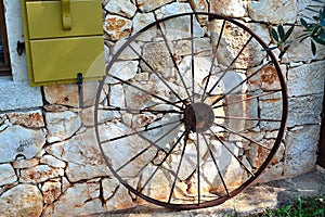 Still life of a ring from a village carriage near a stone wall