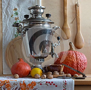 Still life with a Russian samovar and pumpkins.