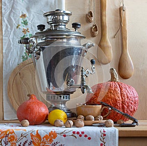 Still life with a Russian samovar and pumpkins.