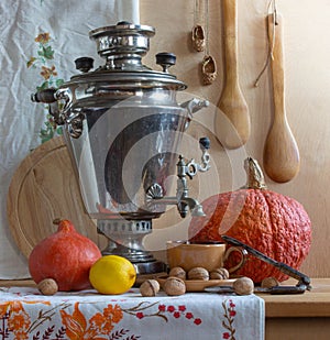 Still life with a Russian samovar and pumpkins.