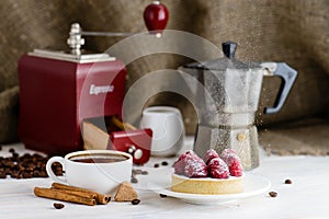 Still life in rustic style, fresh tartlet with raspberries and h