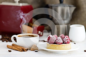 Still life in rustic style, fresh tartlet with raspberries and h