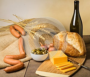 Still life with sausage cheese and bread