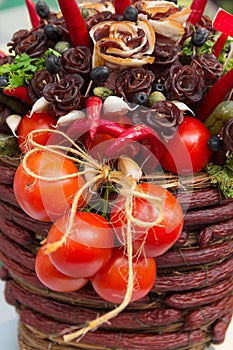 Still-life with sausage tomatoes and peppers on the counter of the bazaar