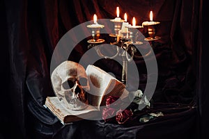 Still life with skull, book and candlestick