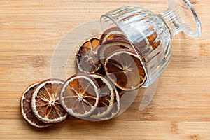 Still life of sliced citrus in a glass vase, slices of oranges, grapefruit, lemons.